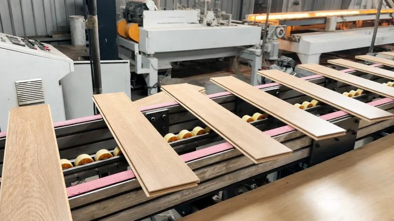 Laminate flooring factory production environment illustrating the importance of consistent manufacturing and batch control.